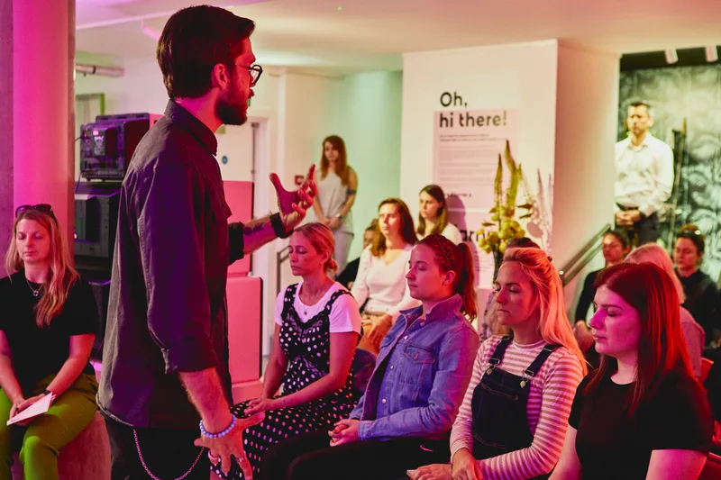 Chevy Rough leading a breathing session for a corporate audience